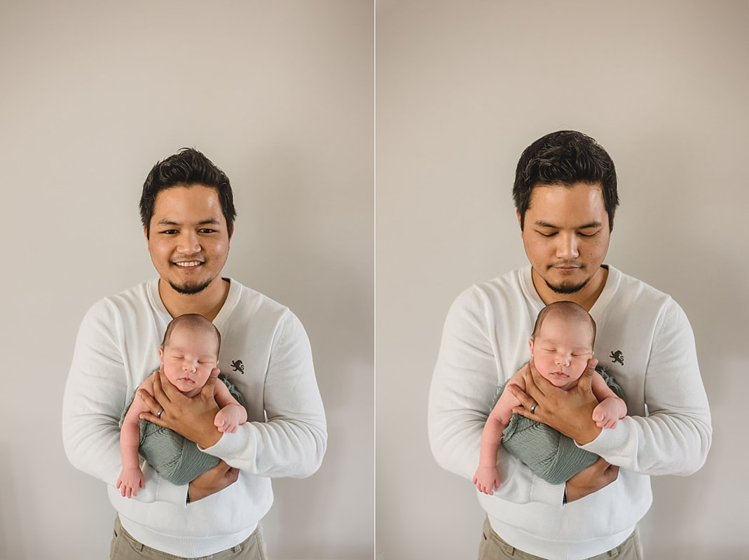 father holding newborn baby boy for newborn portraits in memphis tn