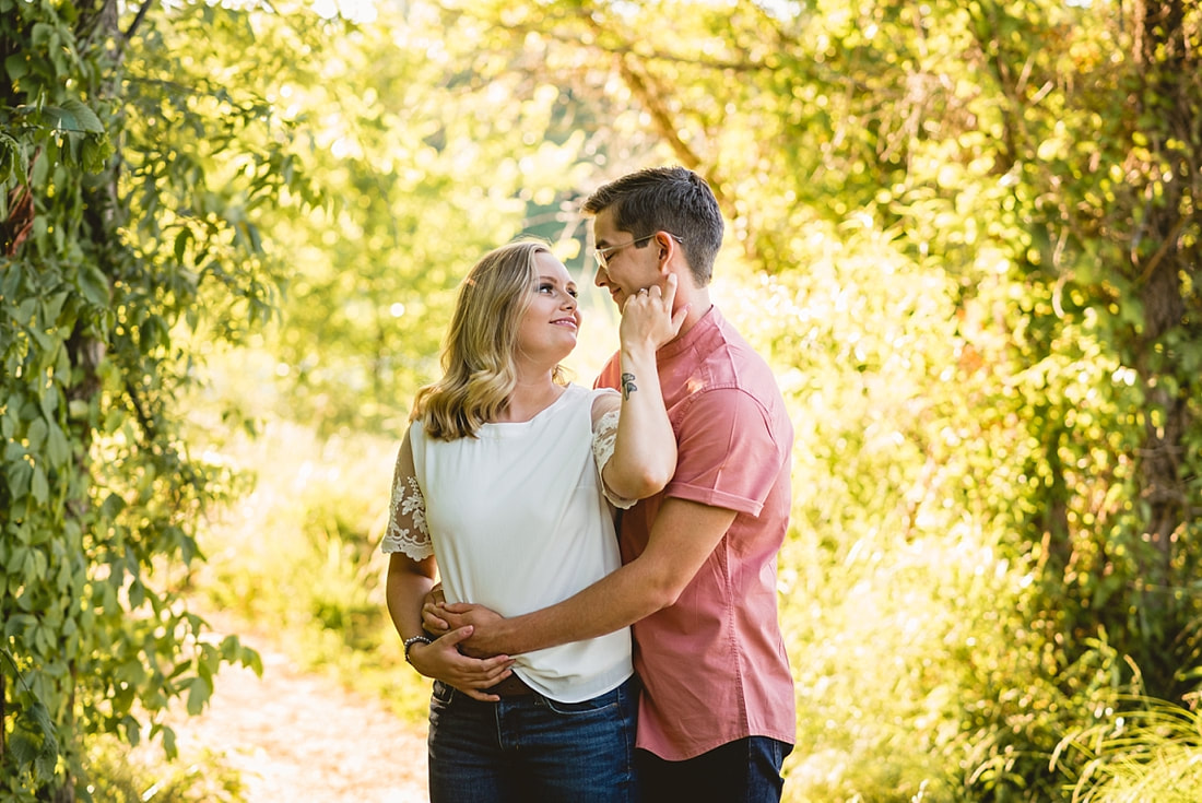 couple posing for engagement photos at shelby farms park in memphis, tn