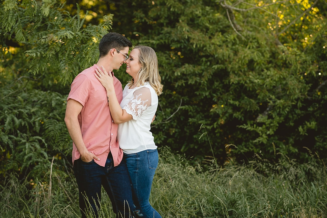 couple posing for engagement photos at shelby farms park in memphis, tn