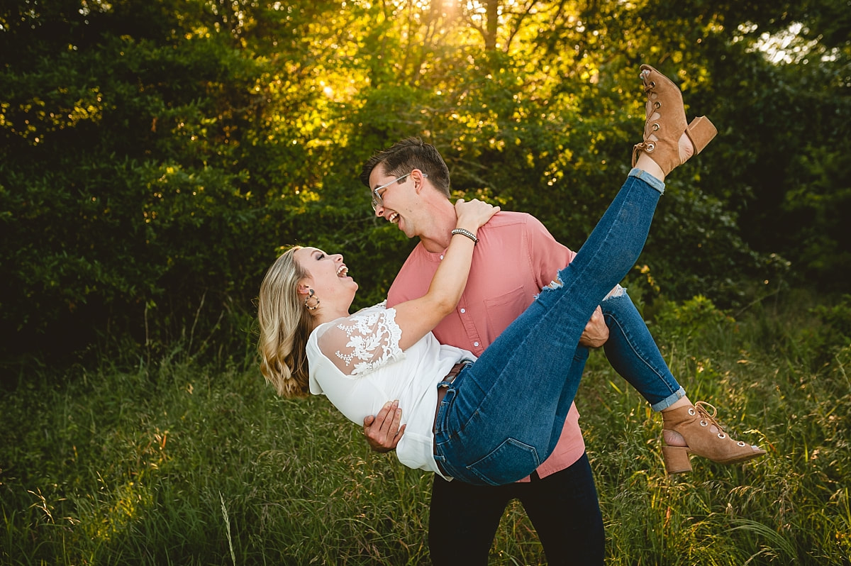 couple posing for engagement photos at shelby farms park in memphis, tn