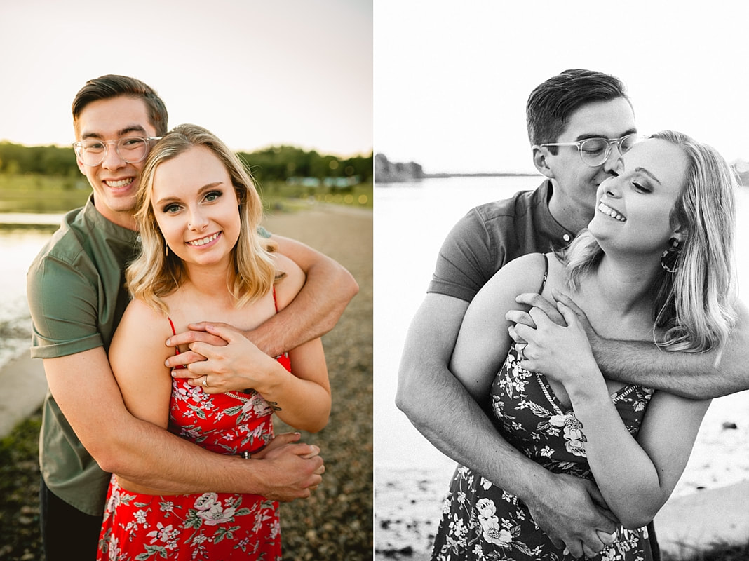 couple posing for engagement photos by the lake at shelby farms park in memphis, tn