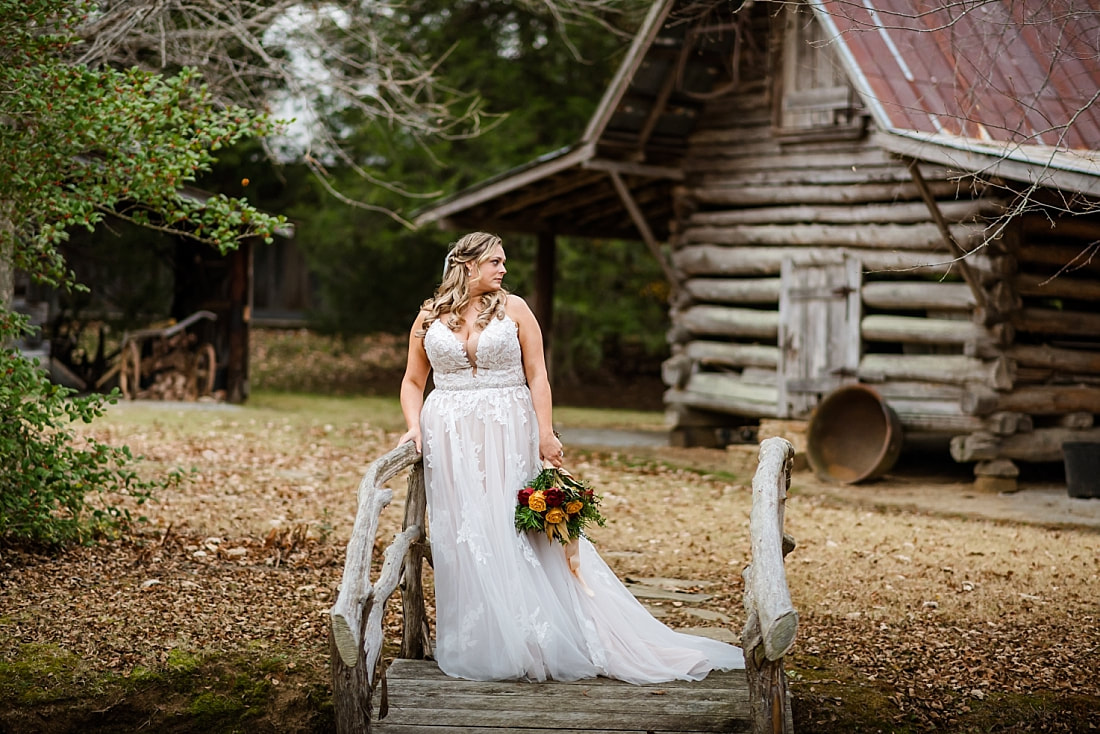 Bridal wedding portraits on old rustic bridge at Green Frog Farm