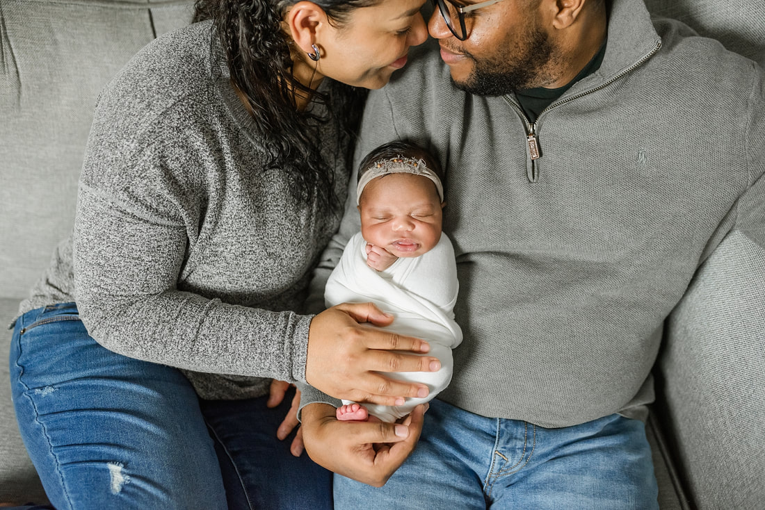 portrait of new parents with newborn baby in Memphis, TN