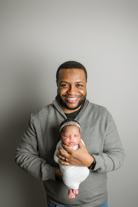 portrait of new parents with newborn baby in Memphis, TN