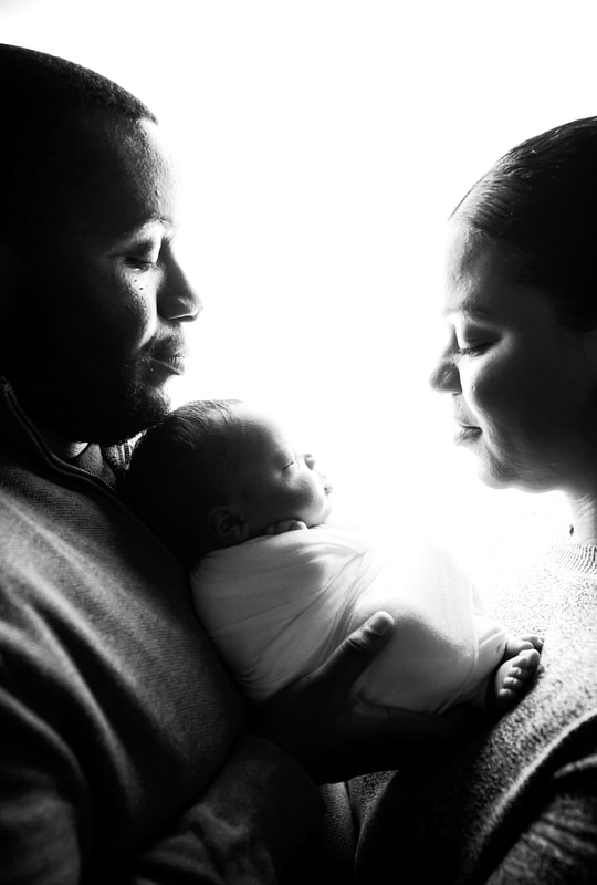 portrait of new parents with newborn baby in Memphis, TN