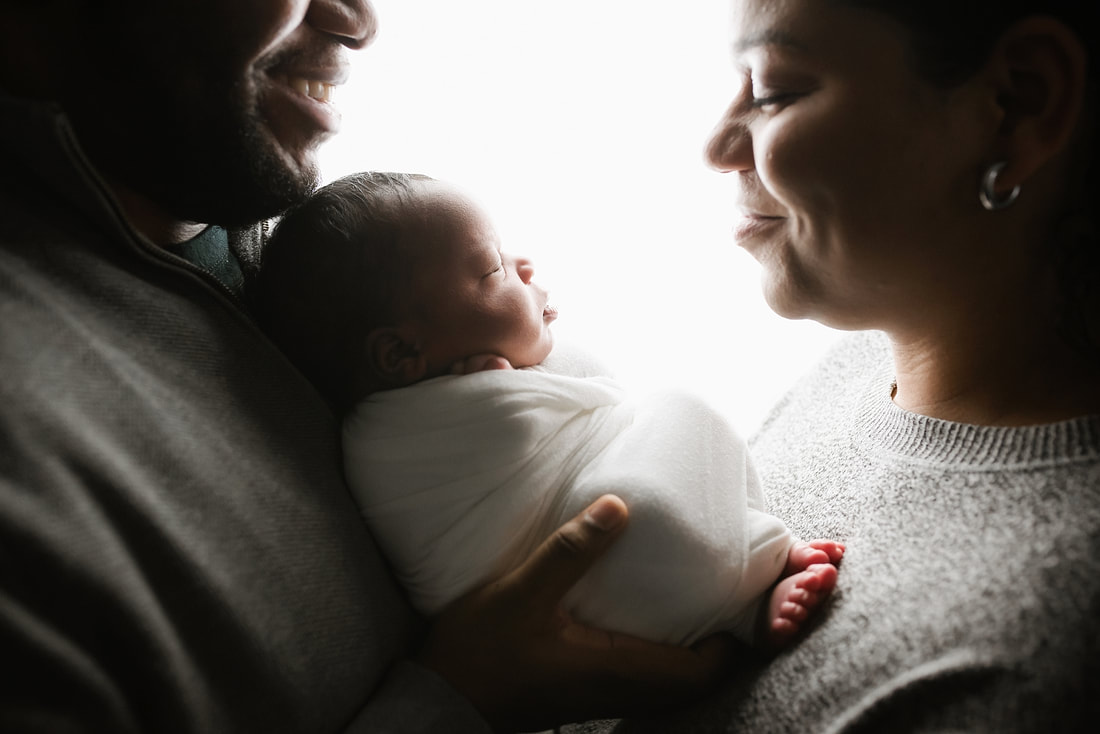 portrait of new parents with newborn baby in Memphis, TN