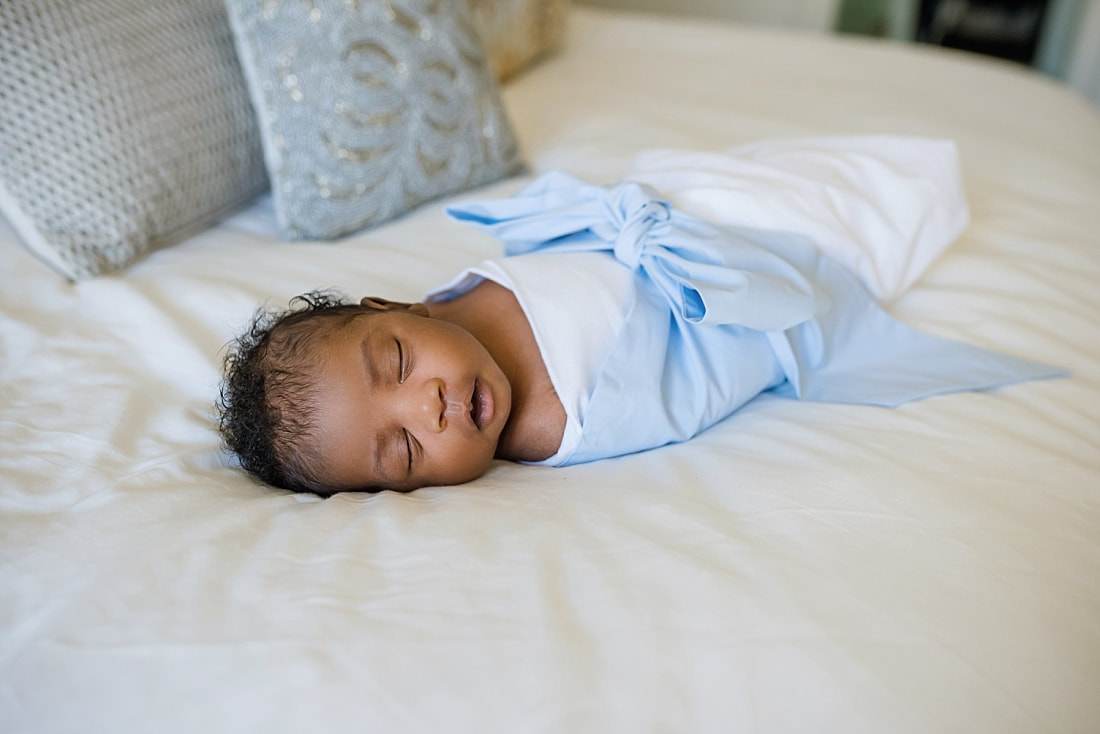 Baby boy wrapped in a Bow Swaddle by The Beaufort Bonnet Company for newborn photos in Collierville, TN