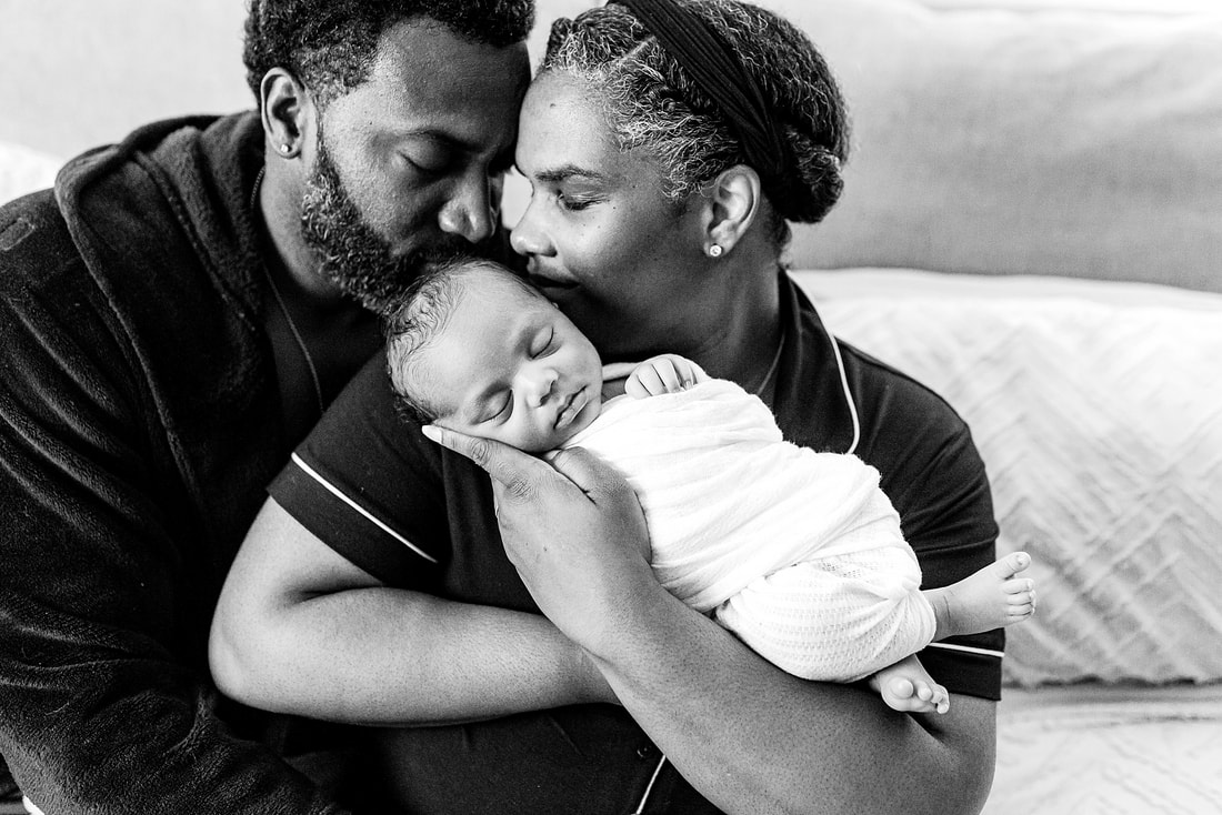 portrait of new parents with newborn baby in Memphis, TN