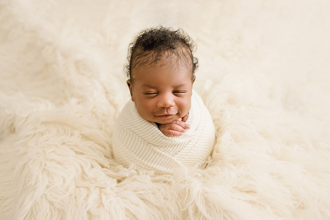 Baby Boy wrapped in cream blanket for newborn photos with Sarah Morris photography