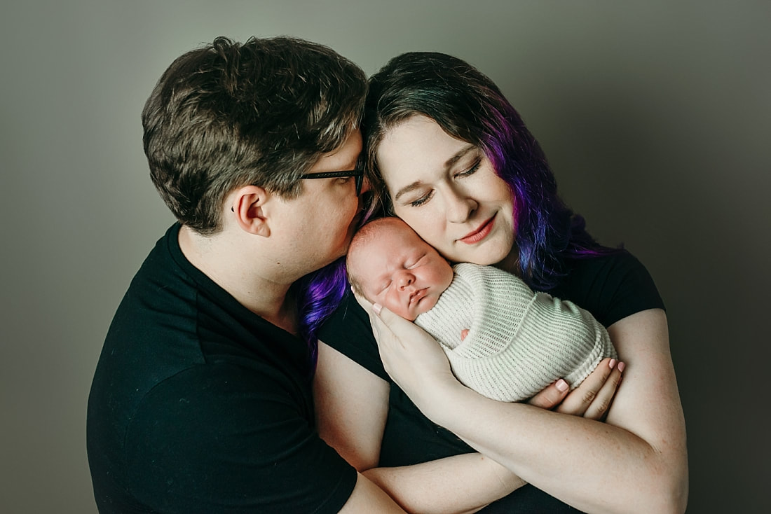 newborn baby with parents for newborn photos in Memphis, TN