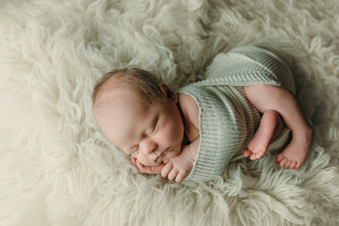 newborn baby wrapped in ivory blanket for newborn portraits in Memphis, TN