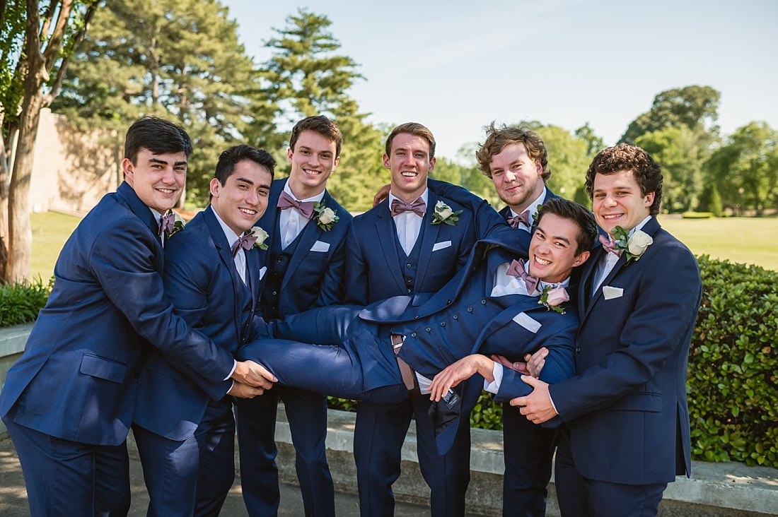 groomsmen holding up groom + Pink Palace Wedding + Memphis, TN